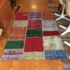 Vintage Turkish Over-Dyed Patchwork Area Rug 4′ × 5′11 | touchGOODS